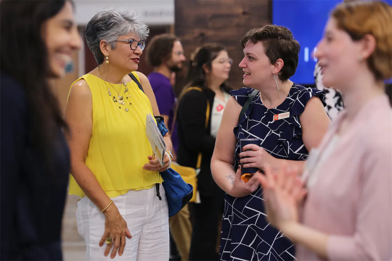 Women talking at a conference