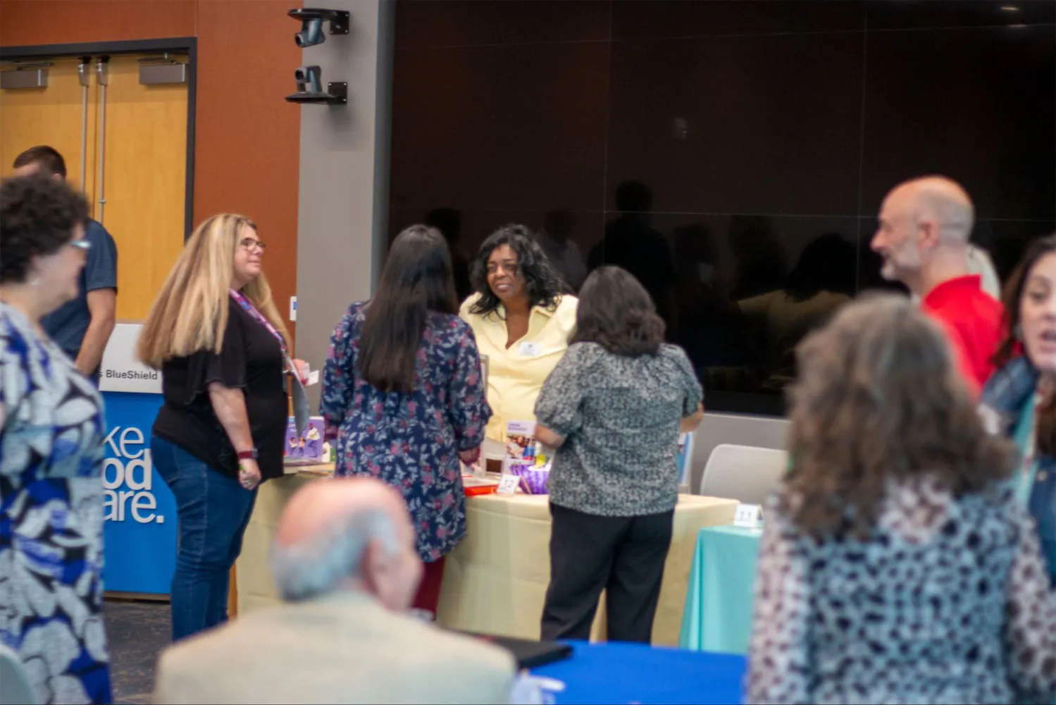 People meeting and talking at a convention.